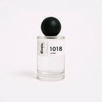Bote de perfume equivalente unisex divain.1018