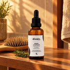 Densify Scalp Elixir en un estante de madera con cepillo y romero
