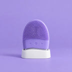 Masajeador limpiador facial divain. Care lila en su soporte