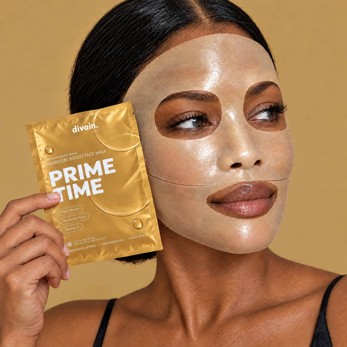 Model wearing the Prime Time mask, holding the sachet
