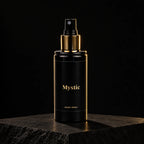 Ambientador en spray Mystic de divain. sobre piedra negra