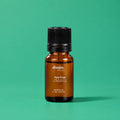 Aceite esencial de árbol de té divain. RITUAL 10 ml sobre fondo verde