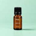 Aceite esencial de menta piperita divain. RITUAL 10 ml sobre fondo verde menta