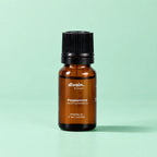 Aceite esencial de menta piperita divain. RITUAL 10 ml sobre fondo verde menta