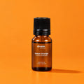 Aceite esencial de naranja dulce divain. RITUAL 10 ml sobre fondo naranja
