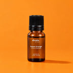 Aceite esencial de naranja dulce divain. RITUAL 10 ml sobre fondo naranja