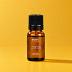 Aceite esencial de ylang ylang divain. RITUAL 10 ml sobre fondo amarillo dorado