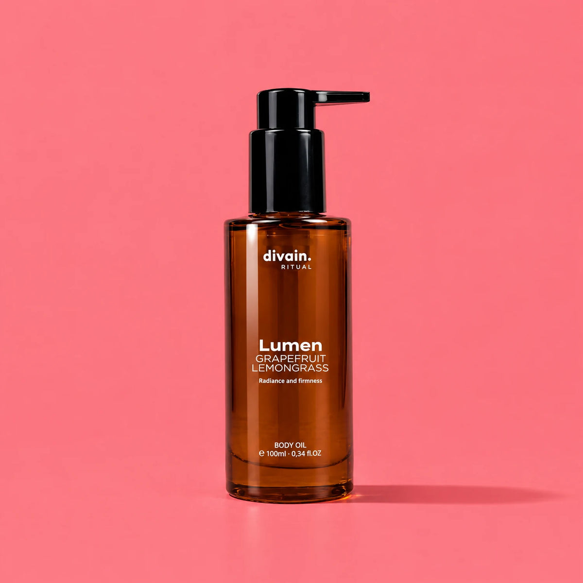 Lumen Body Oil divain. RITUAL 100 ml sobre fondo coral pomelo
