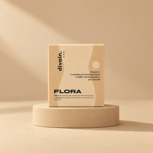 FLORA divain. ZEN, complemento con microorganismos vivos y vitamina C sobre fondo arena