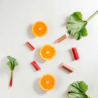 Notas olfativas cítricas y verdes con naranja, ruibarbo y hojas frescas