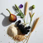 Higo, trigo, cebada y grosellas negras representando las notas olfativas del perfume.