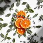 Naranja y menta representando las notas olfativas del perfume.