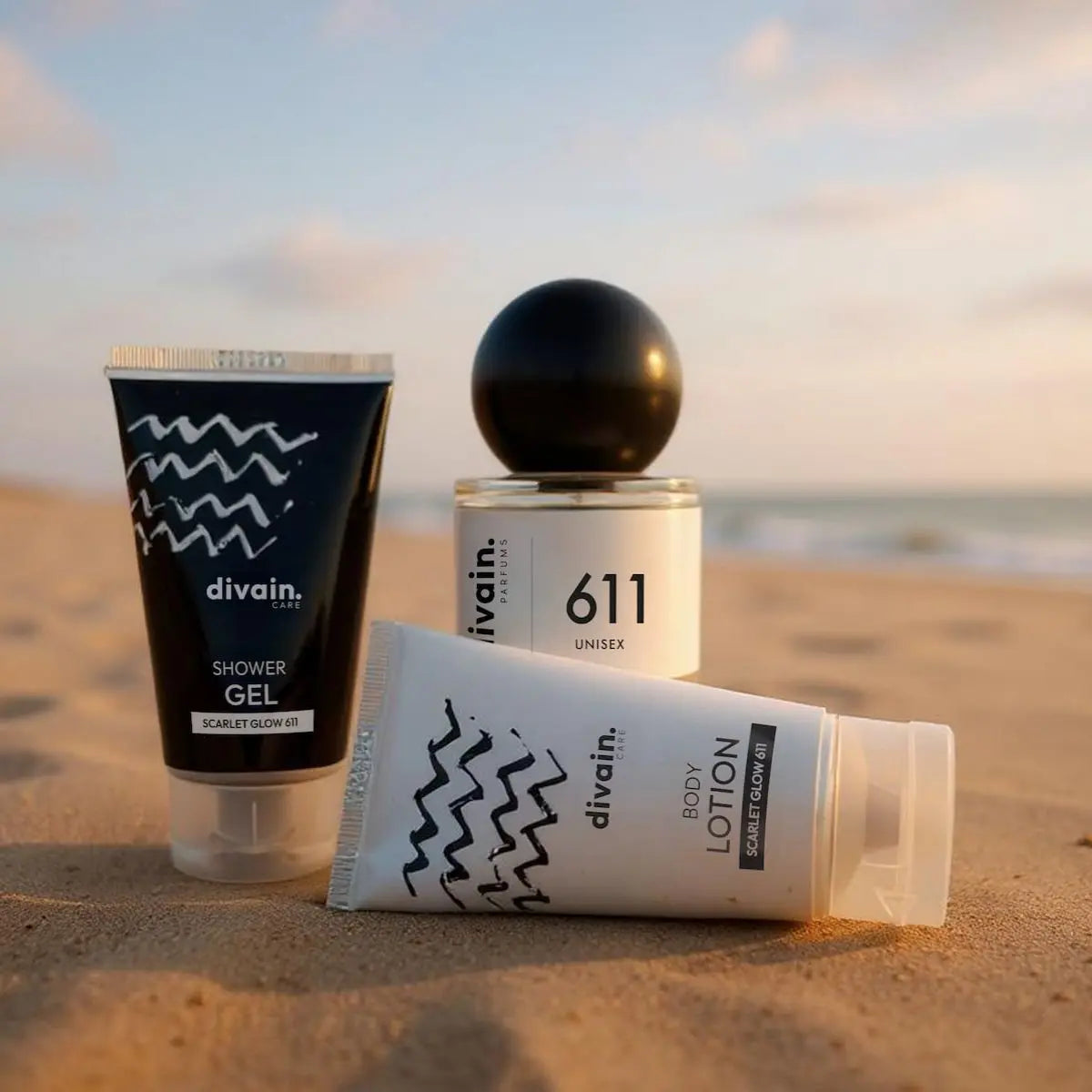 Perfume divain 611 unisex con su crema corporal y su gel en la playa.