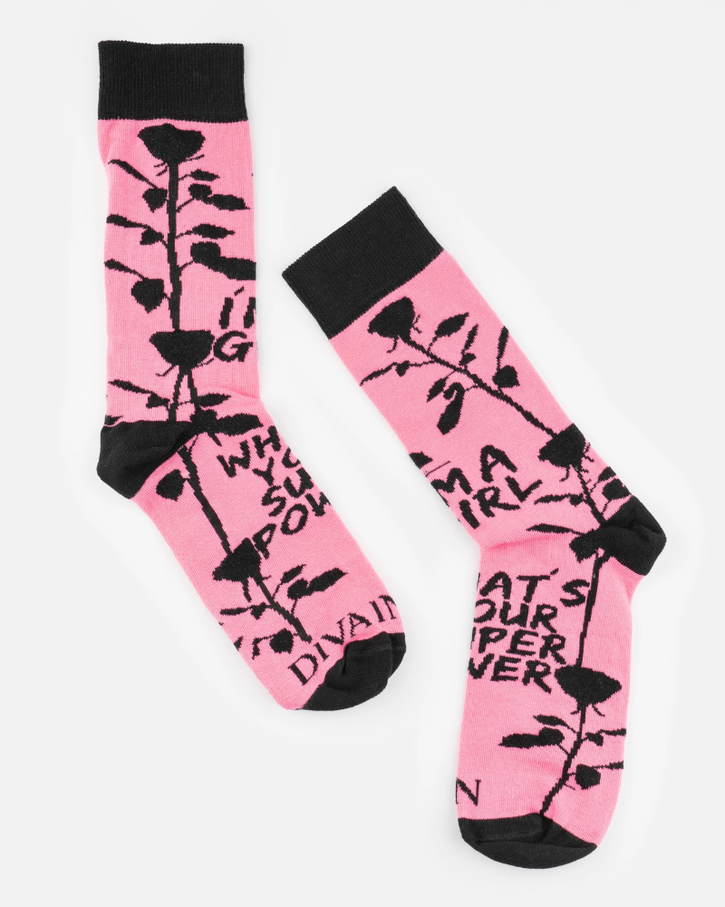 Pink socks with a black flower with thorns